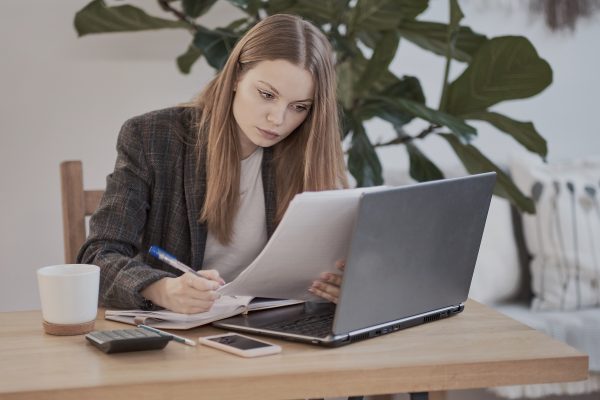 woman typing out employee handbook